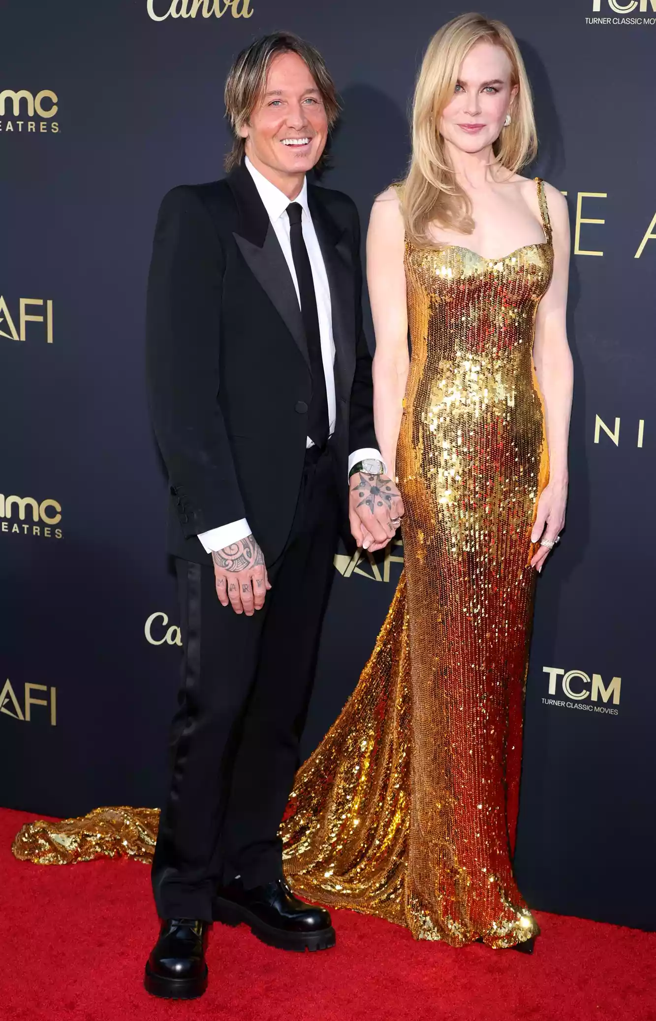 Nicole Kidman and Keith Urban stand alongside their teenage daughters Sunday and Faith for a memorable photo at her AFI tribute