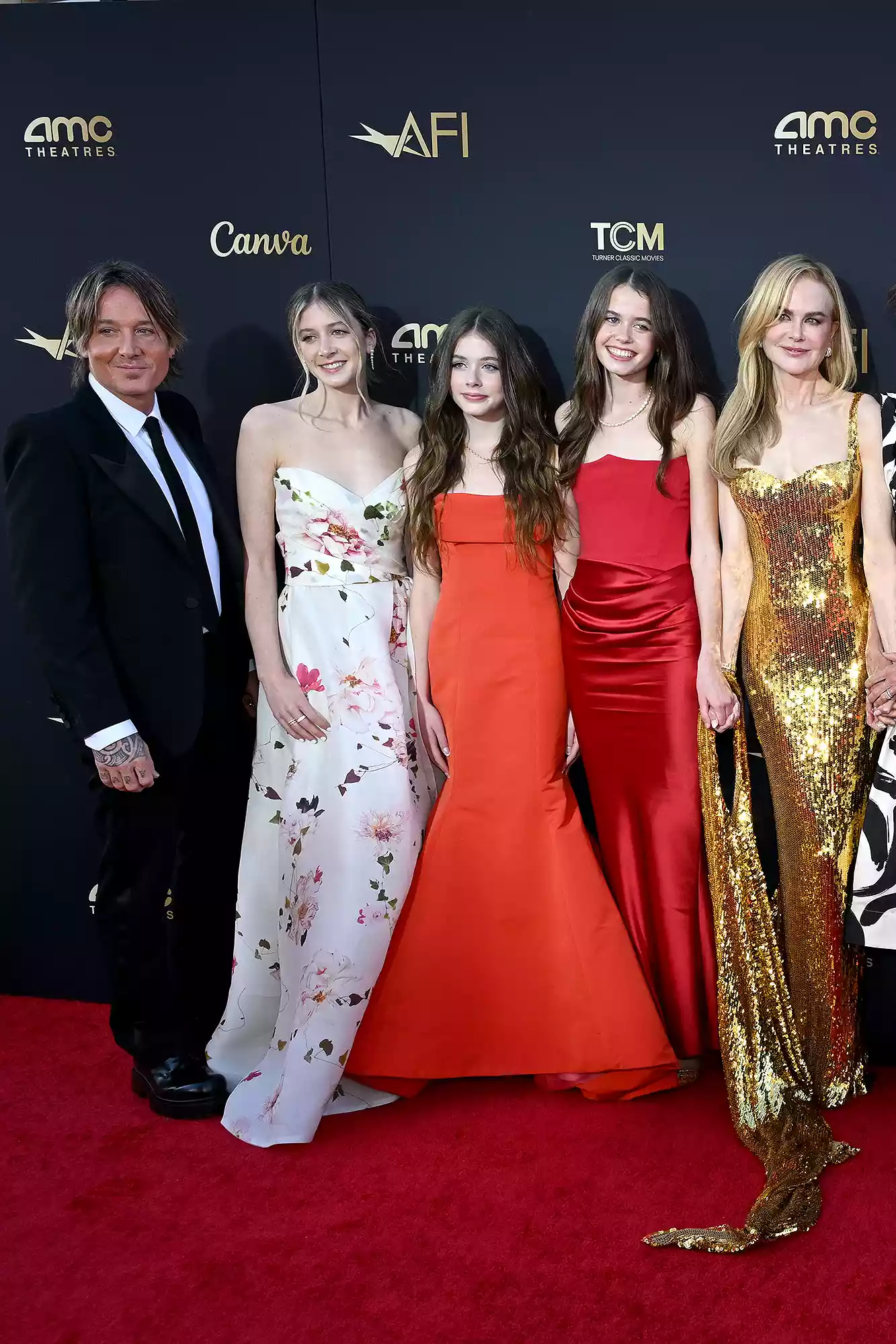 Nicole Kidman and Keith Urban stand alongside their teenage daughters Sunday and Faith for a memorable photo at her AFI tribute
