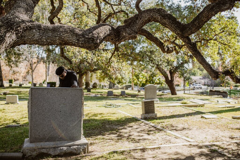 Final step of how bodies are buried in a cemetery – adding the headstone